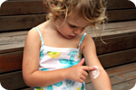 Child-applying-cream-eczema