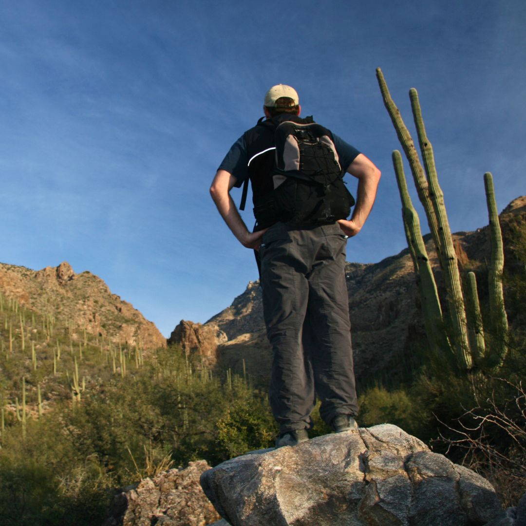 man hiking in desert